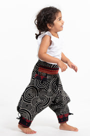 Swirls Prints Thai Hill Tribe Fabric Kids Harem Pants with Ankle Straps in Black